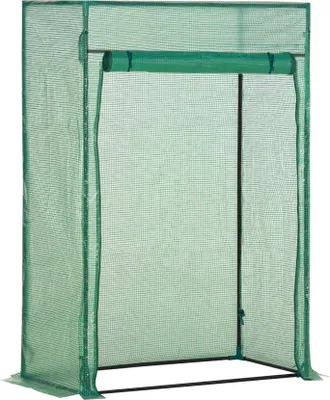 A green greenhouse with a roll-up door.