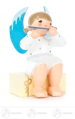Produktbild von Engel mit Querflöte auf Geschenkpaket sitzend Höhe ca 5,5 cm NEU