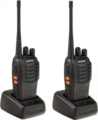 Two black Baofeng BF-888S walkie-talkies are shown in their charging docks against a white background.