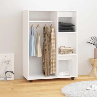 A white wardrobe with clothes hanging inside and shelves with items.