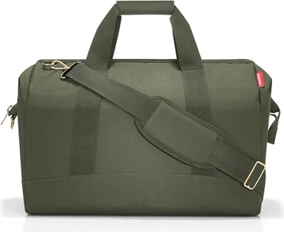 A green duffel bag is shown against a white background.