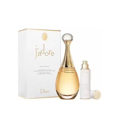 A gift set of Dior J'Adore perfume, including a large bottle and a smaller refillable spray, displayed with its packaging against a white background.