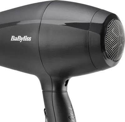 A close-up, studio shot of a black BaByliss hair dryer against a white background.