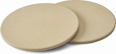 Two round, flat, beige pizza stones are shown on a white background.