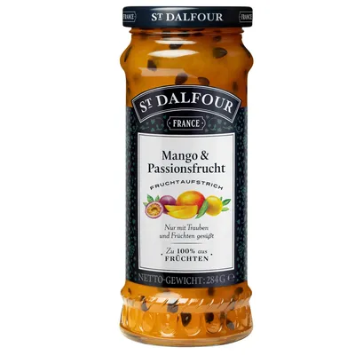 A jar of St. Dalfour Mango & Passionsfrucht jam on a white background.