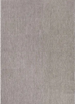 A close-up view of a textured gray fabric, likely a rug or textile.
