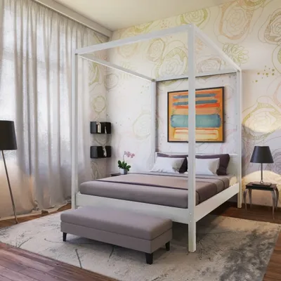 A bedroom scene featuring a canopy bed, artwork, and decor.