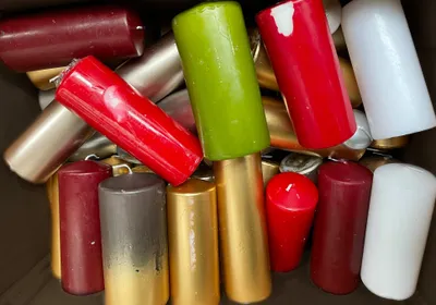A pile of various colored candles.