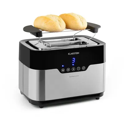 A toaster with two bread rolls on a warming rack.