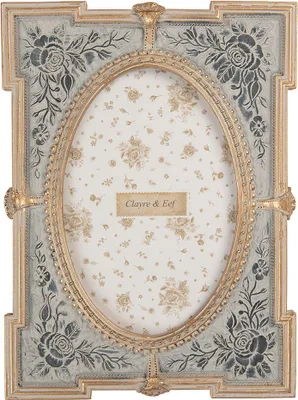 A decorative picture frame with floral patterns and a floral patterned insert.