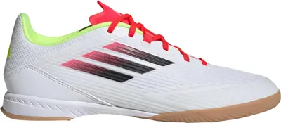 A single Adidas indoor soccer shoe shown from the side.