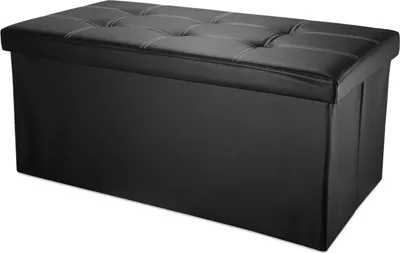 A black storage ottoman with a tufted lid is shown against a white background.