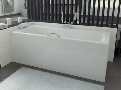 A white bathtub with chrome fixtures is shown in a modern bathroom setting.