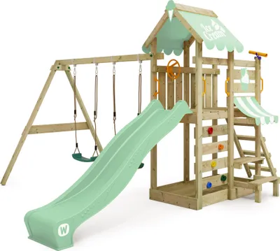 A wooden playground set with swings, a slide, and climbing features, set against a white background.