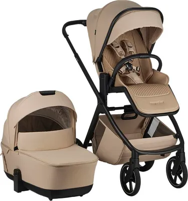 A beige and black stroller with a bassinet attachment, shown against a white background.