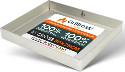 A stainless steel grill tray with a label inside.