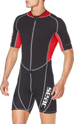 A man wearing a shorty wetsuit.