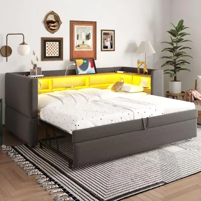 Zdjęcie produktu dla Łóżko tapicerowane z rozkładaną sofą, wymiary 90/180x190 cm, kolor ciemnoszary, wyposażone w oświetlenie LED, gniazdka elektryczne i schowki, idealne do sypialni