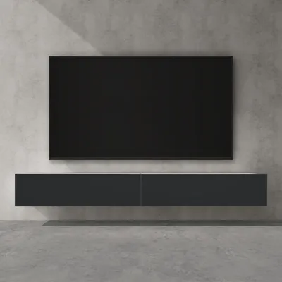 A modern TV stand mounted on a concrete wall.