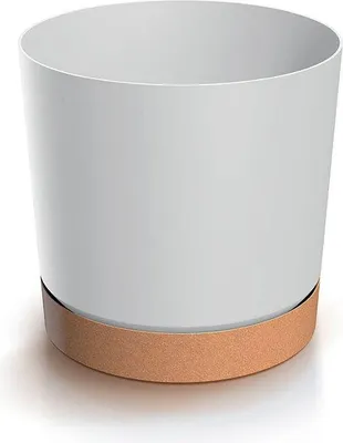 A white cylindrical planter with a brown base sits on a white surface.