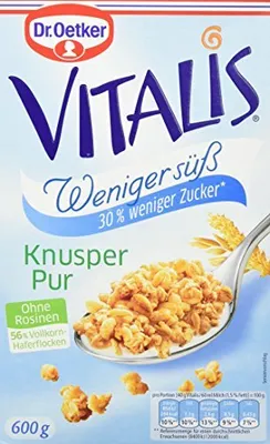 A box of Dr. Oetker Vitalis Knuspermüsli with a spoon full of cereal.