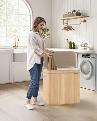 Imagen del producto de Cesta de ropa con tapa de bambú, 150 litros, color beige natural, dimensiones: 62,5 x 41,5 x 61 cm