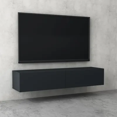 A modern, minimalist living room setup with a wall-mounted TV and a floating media console against a textured concrete wall.