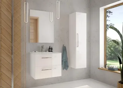 A modern bathroom vanity with a mirror and a tall cabinet, next to a large window.