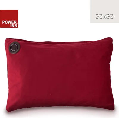 A red rectangular pillow with a dark circular grommet on the left side, presented on a white background.
