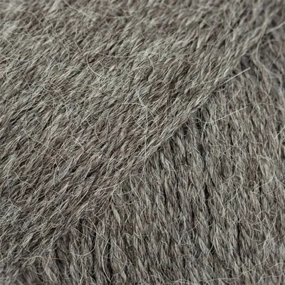 A close-up view of grey yarn.