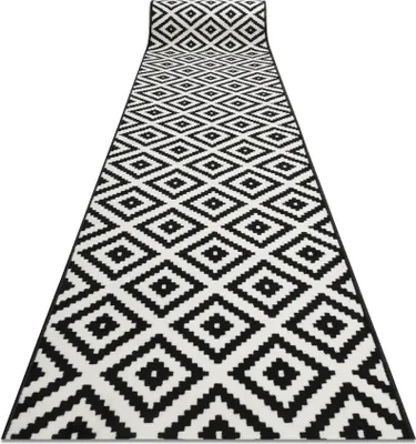 A black and white diamond patterned runner rug is shown from a slightly elevated angle, extending into the distance.