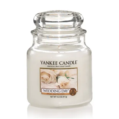 A Yankee Candle "Wedding Day" scented candle in a clear glass jar with a clear glass lid, set against a white background.