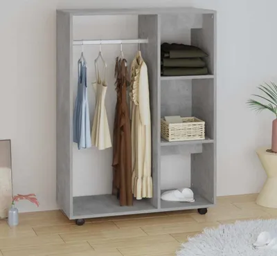 A wardrobe with clothes hanging and folded on shelves.