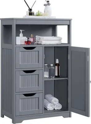A dark gray wooden bathroom cabinet with three drawers on the left and a cabinet with a door on the right, filled with towels and bottles.