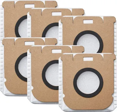 A stack of six vacuum cleaner dust bags.