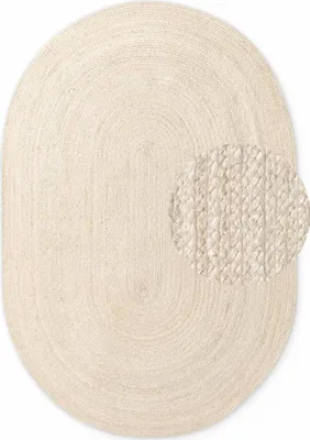 An oval-shaped rug made of braided jute material, shown from a top-down perspective on a white background. A circular inset highlights the texture of the rug.