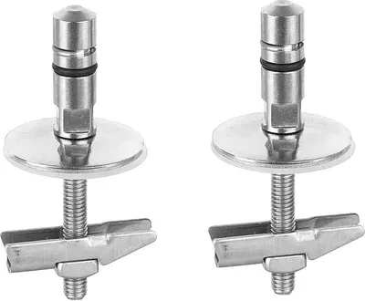 Two metal toilet seat hinges with mounting hardware.