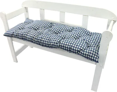 A white wooden bench with a blue and white checkered cushion.