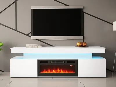 A modern white media console with a built-in electric fireplace is shown in a living room setting.