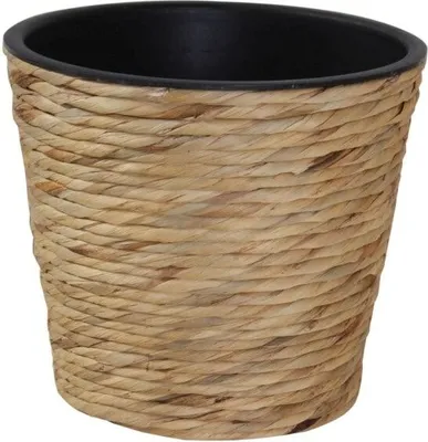 A close-up shot of a woven plant pot with a black interior.