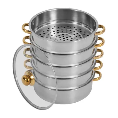 A stacked stainless steel steamer pot with gold handles and a glass lid.