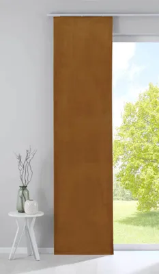 A single panel curtain hangs in front of a window with a view of green trees and a bright sky. To the left, a small white table holds a vase with branches and a decorative white object.
