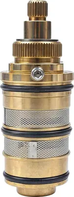 A close-up studio shot of a brass shower valve cartridge.
