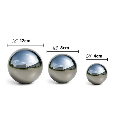 Three polished stainless steel garden balls of different sizes are displayed on a white background, with size indicators above each ball.