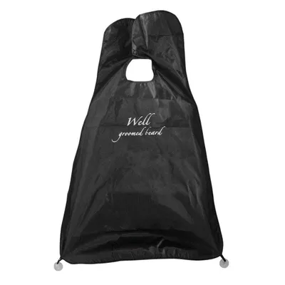 A black beard bib with white text that says "Well groomed beard".