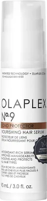 A product shot of a white bottle with black and brown text.