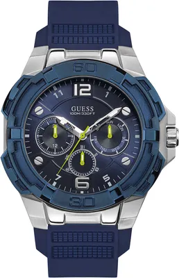 A close-up studio shot of a blue and silver Guess watch with a blue rubber strap.