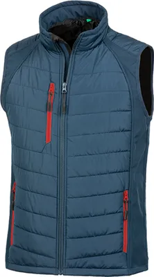 A blue puffer vest with red zipper accents is shown against a white background.
