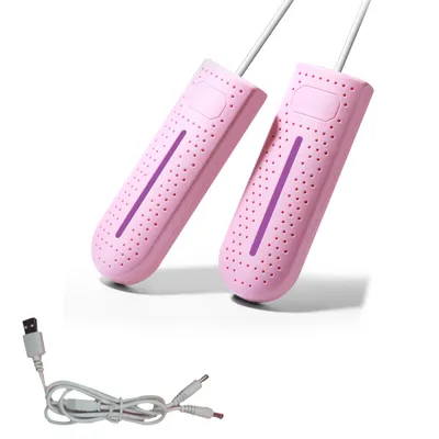 Two pink shoe dryers and a USB cable on a white background.