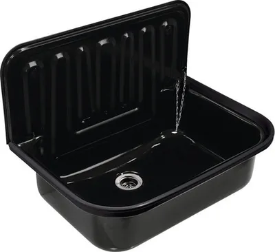 A black sink with a ribbed backsplash and a drain.